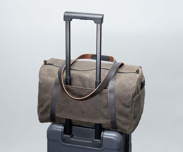 The back has a slip-through feature for sliding on suitcase handles