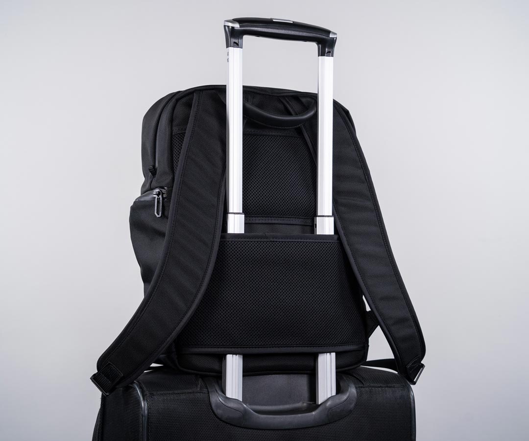 Backpack with slot for luggage handle online